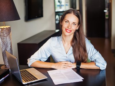 friendly self-employed female lawyer sitting in her office